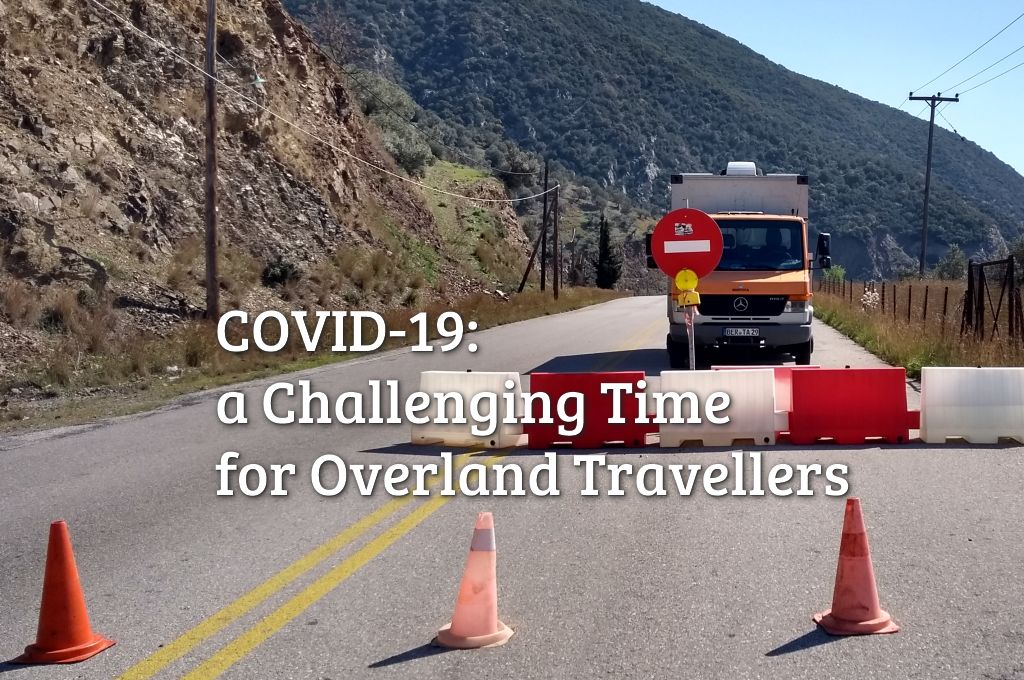 An overlander's travel vehicle stanging at a "Road Closed" sign - that's what's happening everywhere durig the corona crisis