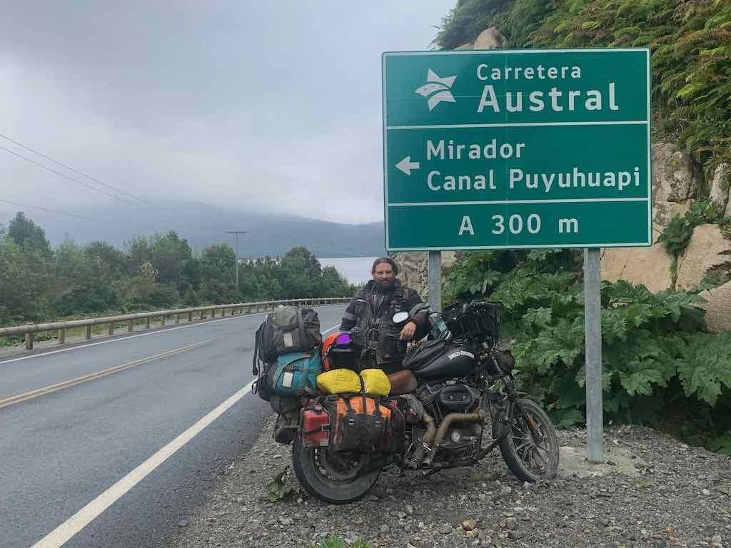 Marco travelling overland with his bike on the Carretera Austral in Chile - before the lockdown.
