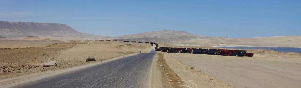 Sadly, Peru's main source of foreign currency is mining. Here mining trucks line up in the middle of the Paracas Reserve.