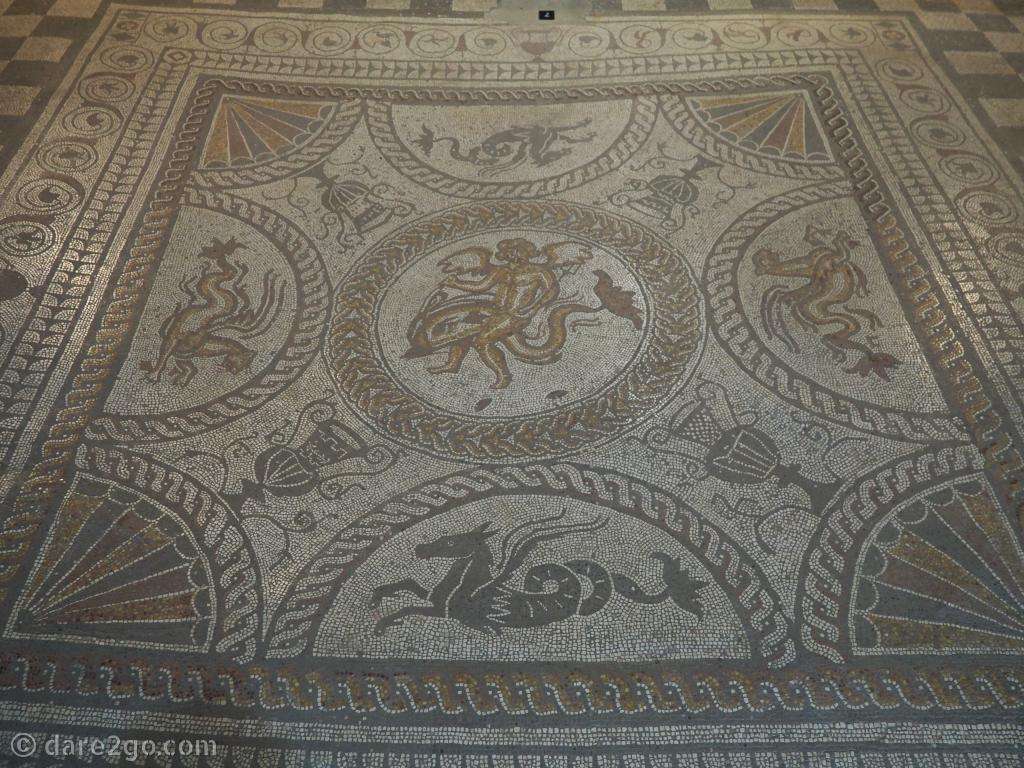 The Cupid on a Dolphin mosaic is in near perfect condition. It's from the 2nd century and is therefore polychromatic.