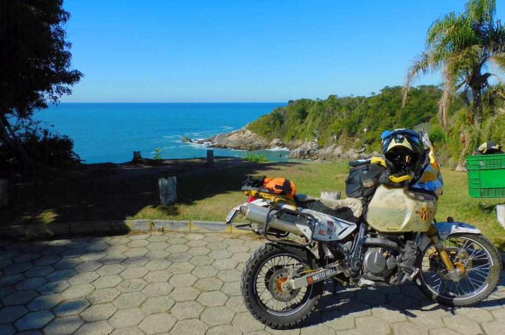 Instead of travel the bike is occasionally used for local trips (motorbike parked near a beach)