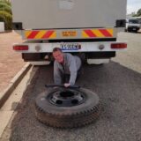 I had to crawl under the truck to connect grey water pipes into the new tank, and to construct a drain outlet for it.