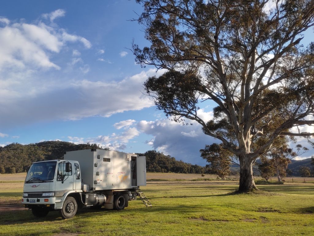Our new base vehicle for the old habitation box: Bert, a 1994 HINO FT truck. Here parked under a magnificent gum tree.