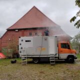 Germany: washing the roof with a high-pressure cleaner.