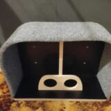 Using the left-over offcuts from building the toilet, I made a small storage box, which sits between the seats in our truck cabin. The board with the holes holds our water bottles securely. The box also stores our camera, some snacks and other small stuff.